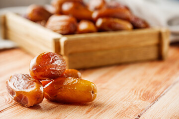 juicy royal dates on a wooden rustic background