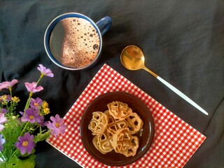 coffee, napkin  and cookies