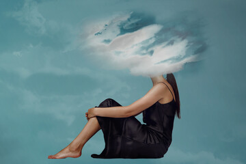 Woman head hidden by soft cloud on blue background, mental health, brain fog