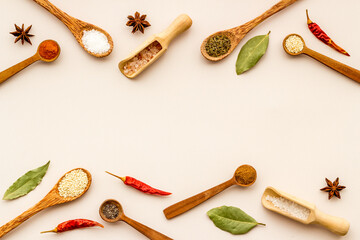 Powdered spices and herbs in wooden spoons. Colorful cooking background