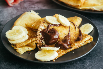 Delicious pancakes on a plate. Pancakes with chocolate