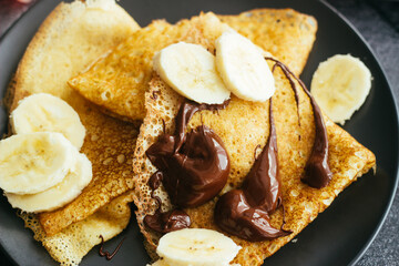Delicious pancakes on a plate. Pancakes with chocolate