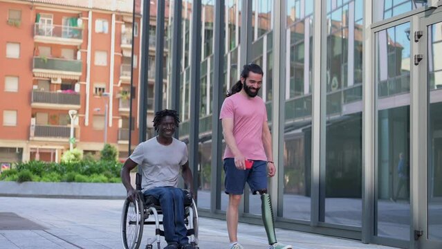 Two multiracial friends walking in the city, person with disabilities lifestyle