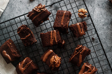 Tasty chocolate brownie. Pieces of cake on the table