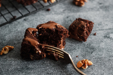 Tasty chocolate brownie. Pieces of cake on the table