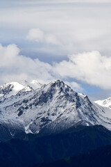 Fototapeta na wymiar Snow-capped, snow covered mountains in Kazakhstan, Almaty
