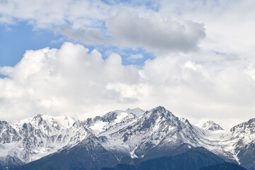 Fototapeta na wymiar Snow-capped, snow covered mountains in Kazakhstan, Almaty