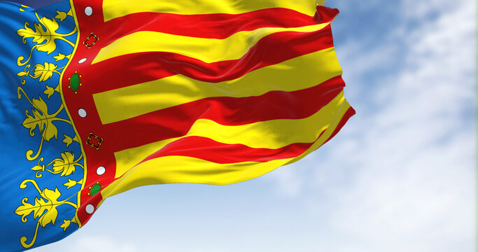 The Valencian Community flag waving in the wind on a clear day