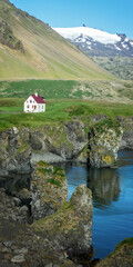 Fototapeta na wymiar Little white house in Arnarstapi, Snaefellsnes peninsula scenic landscape, Iceland