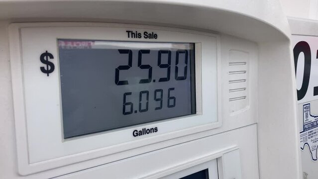 Paying at the Pump gas station fuel counter.
