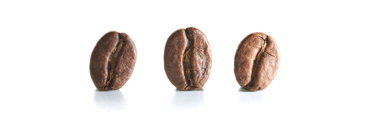Roasted coffee beans isolated close up on white background, clipping path