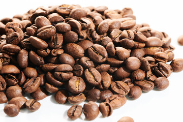 Roasted coffee beans isolated close up on white background, clipping path