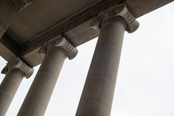 The exterior of a large courthouse with columns and pillars at the colonnade at the facade of the...