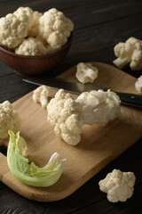 Raw, fresh organic cauliflower on a wooden background. Healthy eating, low carb diet concept