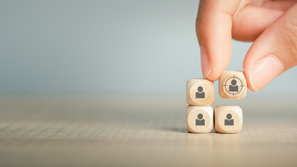 Customer relationship management (CRM), Target customer, buyer persona, marketing segmentation, job recruitment concept. Wooden cube blocks with focused on target customer symbols.