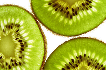 Close-up of three pieces of fresh ripe green kiwi. Kiwi or Chinese gooseberry close-up. Freshly...