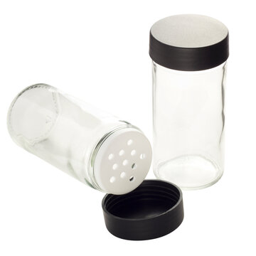 transparent glass jars for spices on a white background