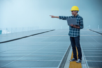 Technician works at a solar power station, Technology solar cell, Engineer check installation solar cell on the roof of factory. Technician inspection and repair solar cell on the roof of factory.