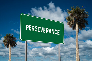 Fototapeta premium Highway sign with the word Perseverance on a beautiful blue sky background with palm trees. Motivational concept for finding what we want on the journey of life.