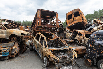 Fototapeta premium War in Ukraine. Car graveyard in Irpin. Shot cars of civilians.