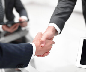 close up.financial partners handshake