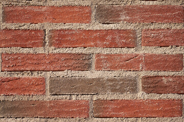 Obraz premium A vintage wall of red bricks as a backdrop.