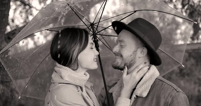 Black and white couple in love under an umbrella