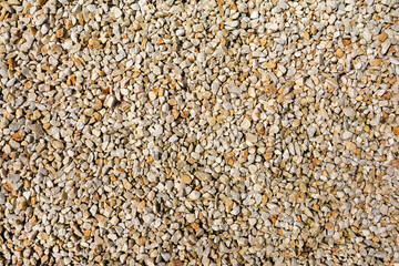 Small dolomite crushed stone as a material for landscape design. Texture of natural beige stone