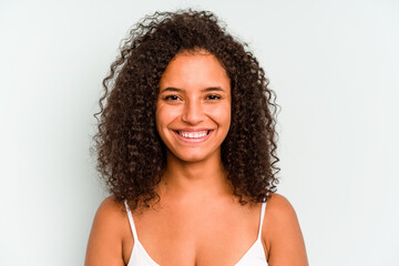 Young Brazilian woman isolated on blue background