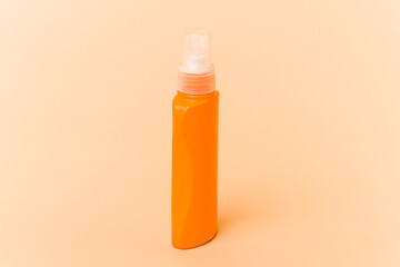 Sun cream isolated on beige background