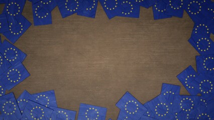 Frame made of paper flags of the European Union arranged on wooden table. 3D illustration