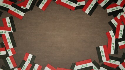 Frame made of paper flags of Iraq arranged on wooden table. National celebration concept. 3D illustration