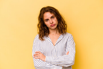 Fototapeta premium Young caucasian woman isolated on yellow background who is bored, fatigued and need a relax day.