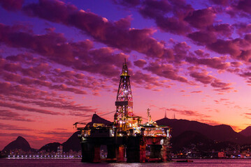 Silhouette of Oil Drilling Rig in Guanabara Bay in Rio de Janeiro, Brazil With Dramatic Sunset Sky