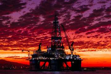 Silhouette of Oil Drilling Rig in Guanabara Bay in Rio de Janeiro, Brazil With Dramatic Sunset Sky