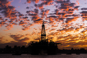 Silhouette of Oil Drilling Rig in Guanabara Bay in Rio de Janeiro, Brazil With Dramatic Sunset Sky