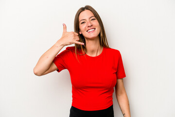 Fototapeta premium Young caucasian pregnant woman isolated on white background showing a mobile phone call gesture with fingers.