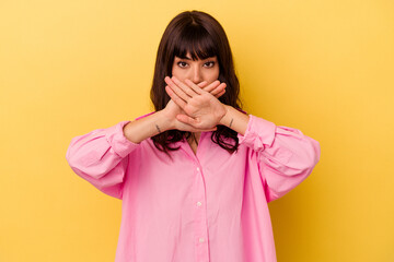 Young caucasian woman isolated on yellow background doing a denial gesture