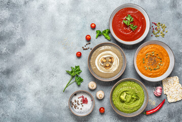 Assortment of Vegetarian Soups. Set of colored vegetable soups. The concept of clean organic food. View from above