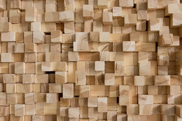 Square wooden rods for texture background. Background of wooden bars of different section. A wall of timber smooth bars without bark