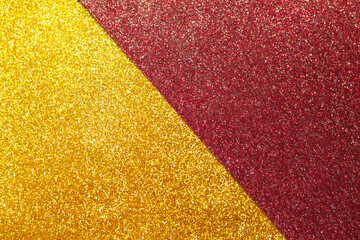 Abstract gold and red glitter background, sparkle texture