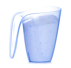 Washing detergent powder in a measuring cup on white background isolation