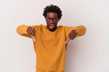 Young african american man isolated on white background  showing thumb down and expressing dislike.