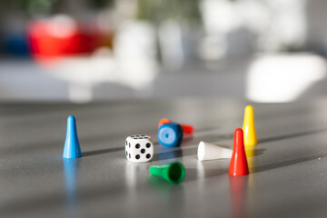 board game with white cubes, chips on a table