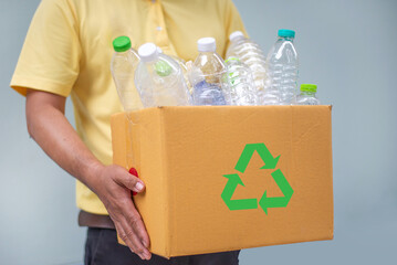 A Man hand holdging box of Pete (polyethylene Terephthalate) for recycle