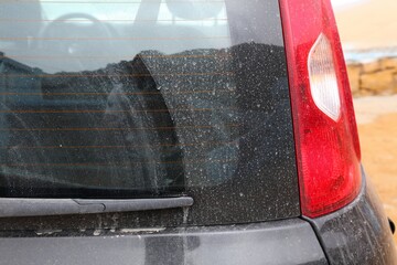 Dirty car rear windshield - obrazy, fototapety, plakaty