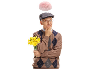 Pensive elderly gentleman holding a bunch of flowers and thinking with brain above his head