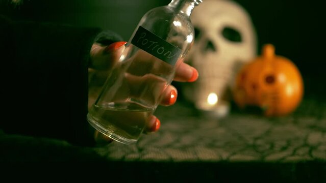 Halloween witch with bottle of potion 