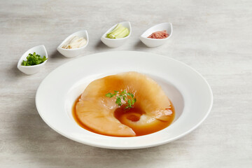 Braised Premium Shark Fin Soup served in a dish isolated on grey background