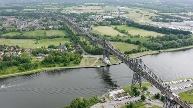 Rendsburg (Schleswig-Holstein, Germany) High Bridge (Rendsburger Hochbr&uuml;cke) railway viaduct (Neum&uuml;nster&ndash;Flensburg line) with Schwebef&auml;hre transporter bridge over Kiel Canal